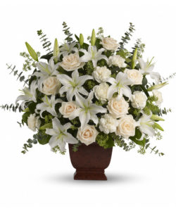 Beautiful flowers in white, lilies, roses, carnations and elegant greenery.