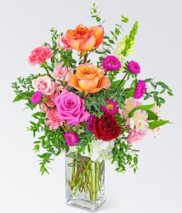 Bringing smiles with local flower delivery is our specialty! Dreaming of Roses is a beautiful bouquet that features a variety of roses, Carnations, Snapdragon, Alstroemeria, Matsumoto Asters, and other premium foliage. This bright design would look beautiful as flowers for the table, the perfect birthday gift, or as a Mother's Day gift. If you want us to deliver roses, but want something a bit less traditional, we suggest sending this unique design.
