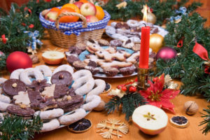 Christmas cookies with decorations on table. A festive meal, cookies with fruit to celebrate Christmas.